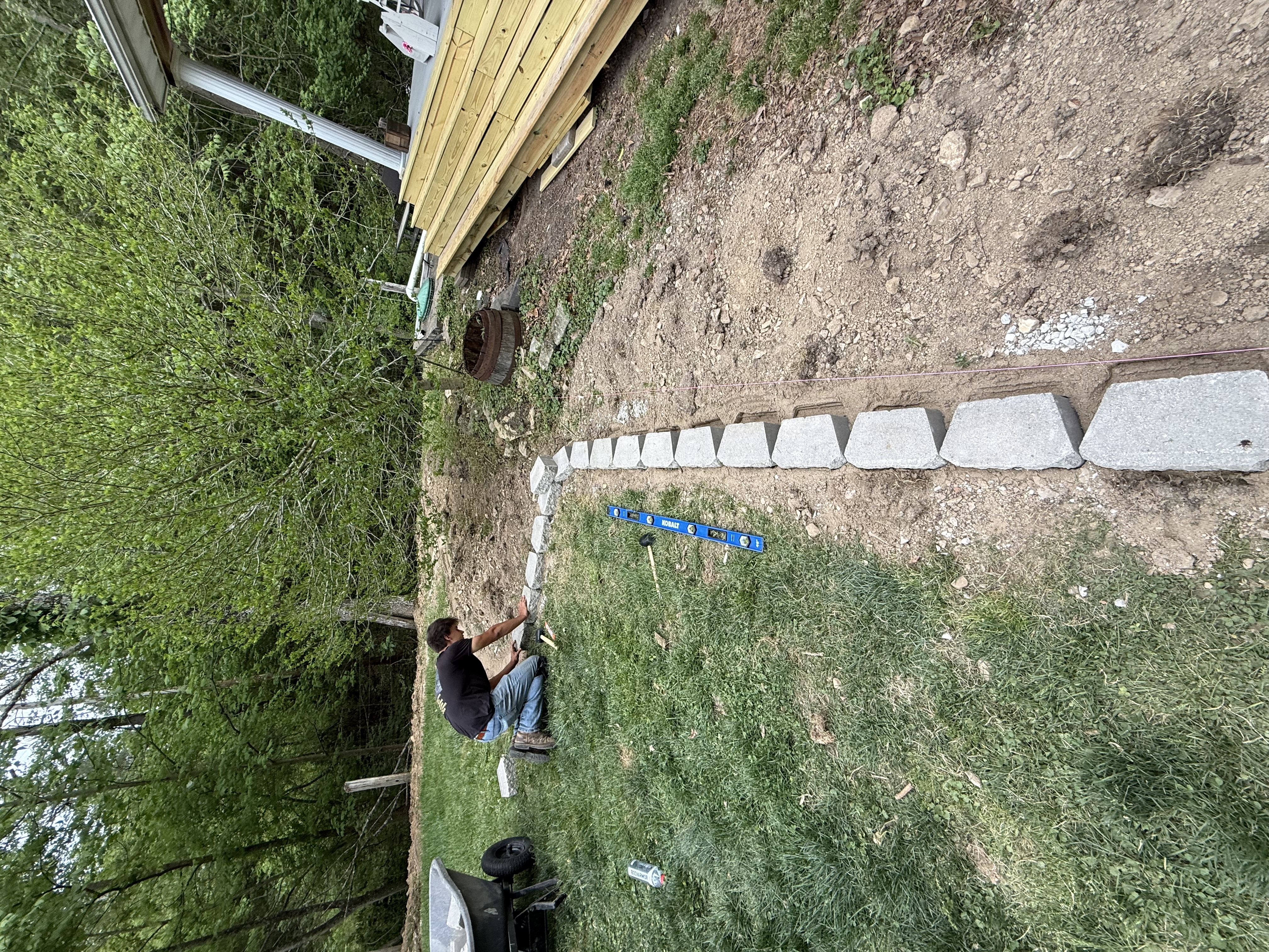 Crew setting and leveling stone border blocks